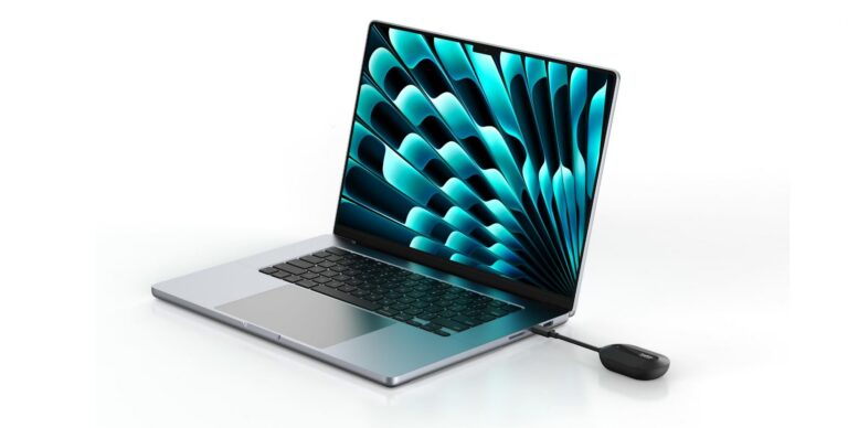 A imagem apresenta um computador portátil de design moderno e minimalista, com um acabamento em metal prateado, posicionado num ângulo de três quartos sobre um fundo branco infinito e limpo. O ecrã do portátil está ligado, exibindo um padrão abstrato vibrante com formas orgânicas que se assemelham a pétalas ou escamas em tons de azul-turquesa e preto, criando um forte contraste visual. Do lado direito do computador, conectado a uma das portas laterais, encontra-se um pequeno dispositivo tecnológico preto de formato ovalado e discreto, que parece ser um adaptador ou emissor de sinal sem fios (como o ConnectAir Wireless HDMI mencionado no nome do ficheiro). Este dispositivo está ligado ao portátil através de um curto cabo preto flexível. A composição geral da imagem é nítida e profissional, transmitindo uma sensação de tecnologia avançada, mobilidade e conectividade sem fios.