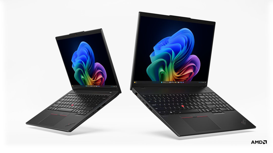 Dois portáteis pretos Lenovo ThinkPad (modelos L14 e L16) flutuam sobre um fundo branco. Os ecrãs mostram o wallpaper colorido do Windows 11. No canto inferior direito, vê-se o logótipo da AMD.