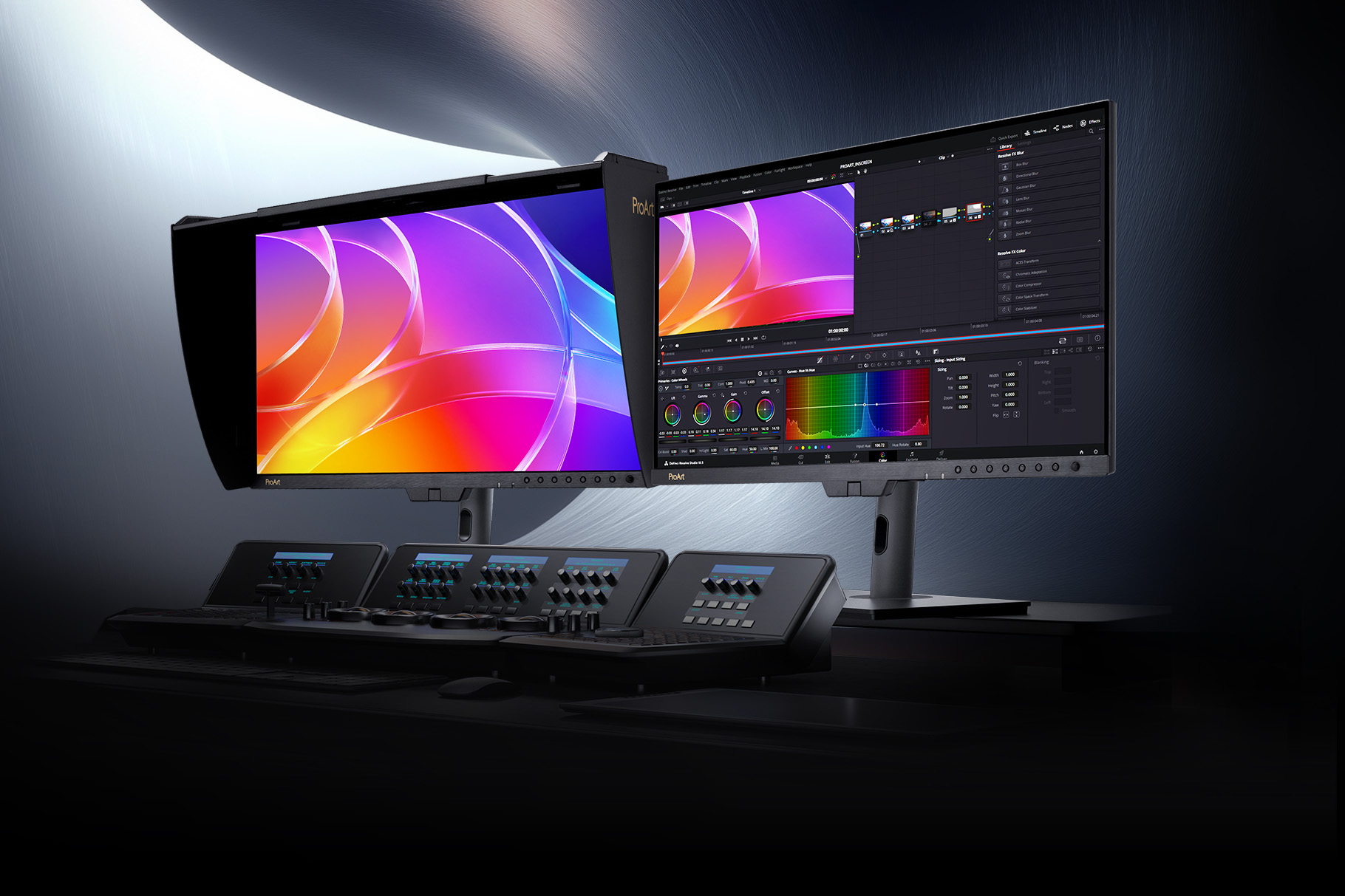 Dois monitores profissionais ASUS ProArt OLED sobre uma mesa com consola de edição de vídeo e correção de cor num ambiente de estúdio escurecido.